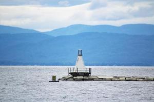 Small lighthouse by the sea photo