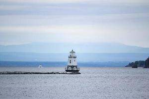 White Lighthouse at Sea photo