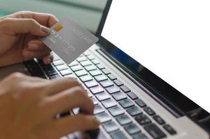 Person using credit card to shop online photo