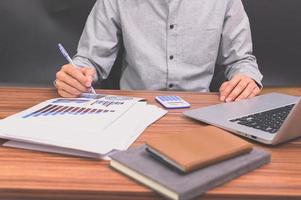 Business people sit at work and check documents At the desk in the room photo