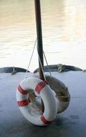 Lifebuoy hanged on a pole photo