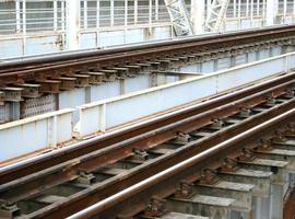 Train tracks on a bridge photo