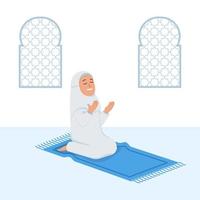 niña musulmana sentarse y orar en estera de oración vector
