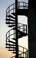 Spiral staircase at sunset photo