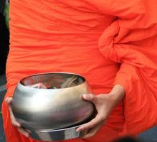 Monk with bowl photo