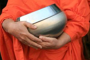 Monk holding bowl photo