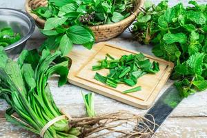 Green herbs on table photo