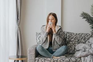 Woman sipping coffee photo