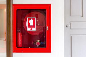 Fire extinguisher and fire hose photo