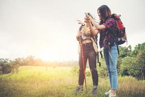 Two woman hiking to the mountain photo