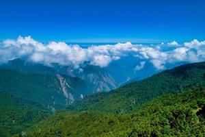 Green mountains and clouds photo