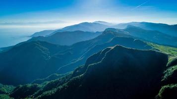 Foggy mountains and a blue sky photo