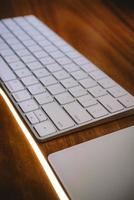 Keyboard on wooden table photo