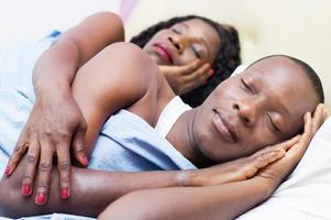 Couple embracing in bed photo