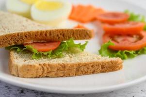 Boiled egg with tomatoes and carrots photo