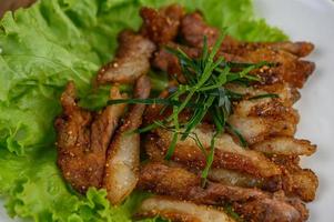 Grilled pork neck on a wooden table photo