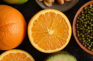 A slice of fresh orange, some mung bean and avocado photo