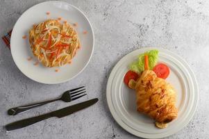 Appetizing almond twist bread and croissant photo