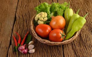 Bell pepper, tomato, onion, salad, chili, shallot, garlic, cauliflower and kaffir lime leaves photo