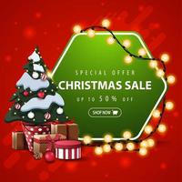 Special offer, Christmas sale, up to 50 off, square red and green banner with hexagonal sign wrapped garland and Christmas tree in a pot with gifts vector