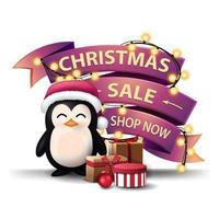 Venta de navidad, compre ahora, banner de descuento en forma de guirnalda envuelta en cintas rosas, pingüino con gorro de santa claus con regalos y árbol de navidad