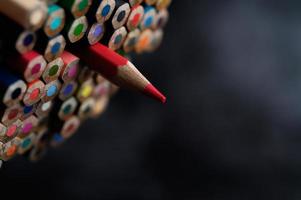 Close-up group of colored pencils, selected focus on red photo