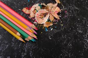 Close-up of color pencils and shavings, flat lay photo