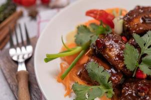 Sweet pork with chili, spring onions, carrots and coriander