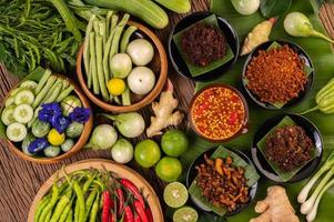 Different types of chili sauce with ingredients to make a Thai cuisine photo