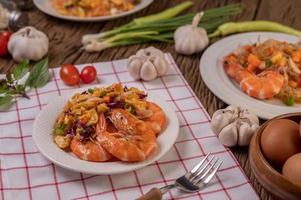 Fried shrimp with eggs on a red and white cloth photo