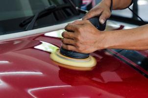 Polishing a red car photo