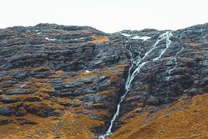 Waterfall in a black rock mountain