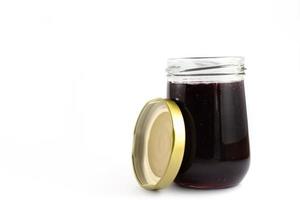 Glass jar of jam photo