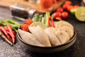 Rugby fish balls with lemon chili paste, tomato and chili photo