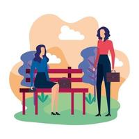 elegant businesswomen seated in the park chair
