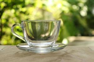 Clear glass on table outside photo