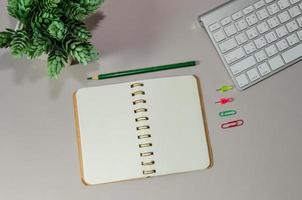 Office desk with open notebook photo