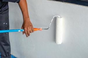 Painter using a white roller photo