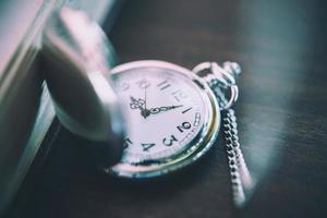 Vintage pocket watch, symbols of time with copy space photo