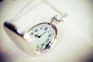 Vintage pocket watch, symbols of time with copy space photo