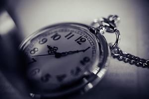 Vintage pocket watch, symbols of time with copy space photo