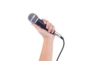 Hand holding microphone on a white background