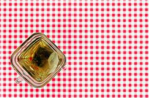 Cup of tea on tablecloth photo