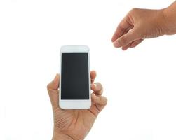 Hand holding phone on white background photo