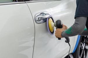 Polishing the car exterior photo