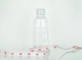 Water bottle and measuring tape photo