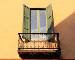 Green shutters on window photo