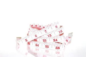 White and red measuring tape photo