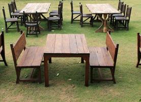 Wooden table and chairs outdoors photo