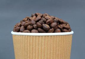 Coffee beans in cup photo